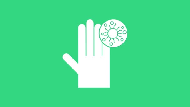 Біла рука з іконкою вірусу ізольована на зеленому тлі. Вірус корони 2019-nCoV. Бактерії та мікроби, рак клітин, мікроби, гриби. 4K Відео рух графічна анімація — стокове відео