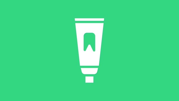 White Tube of toothpaste icon isolated on green background. 4K Video motion graphic animation — Stock Video