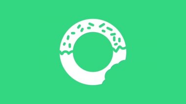 Yeşil arka planda izole edilmiş tatlı simgeli beyaz çörek. 4K Video hareketli grafik canlandırması