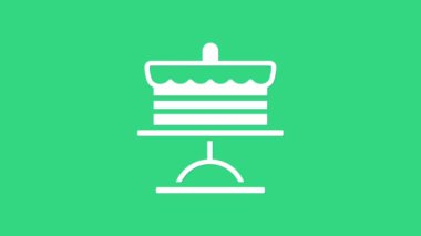 Yeşil arkaplanda beyaz pasta simgesi izole edildi. Doğum günün kutlu olsun. 4K Video hareketli grafik canlandırması