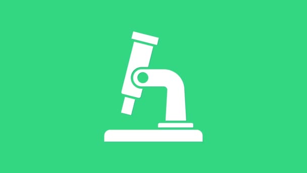 화이트 마이크로 스코프 아이콘은 녹색 배경에서 분리되었습니다. 화학, 약학, 미생물학, 확대 도구. 4K 비디오 모션 그래픽 애니메이션 — 비디오