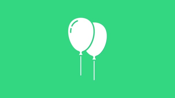 Witte ballonnen met lint pictogram geïsoleerd op groene achtergrond. Vrolijk Pasen. 4K Video motion grafische animatie — Stockvideo