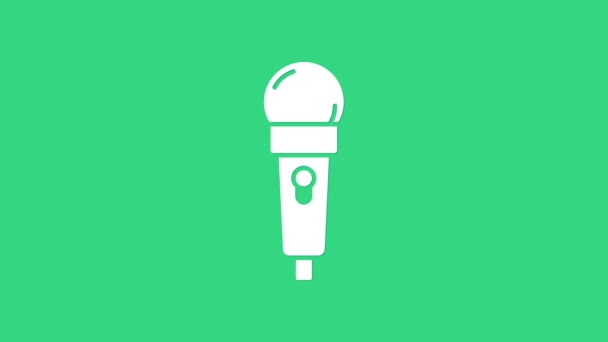 Ikon mikrofon putih diisolasi pada latar belakang hijau. Di mikrofon radio udara. Tanda pembicara. Animasi grafis gerak Video 4K — Stok Video