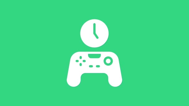 緑色の背景に隔離された時間アイコンのホワイトゲームパッド。ゲームをプレイする時間。ゲームコントローラー。4Kビデオモーショングラフィックアニメーション — ストック動画