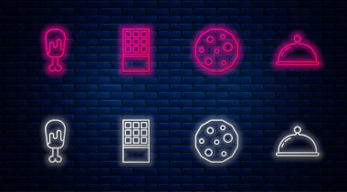 Çikolata, kurabiye ya da bisküvi, tavuk budu ve tepsiyle kaplı. Tuğla duvarda parlayan neon simgesi. Vektör