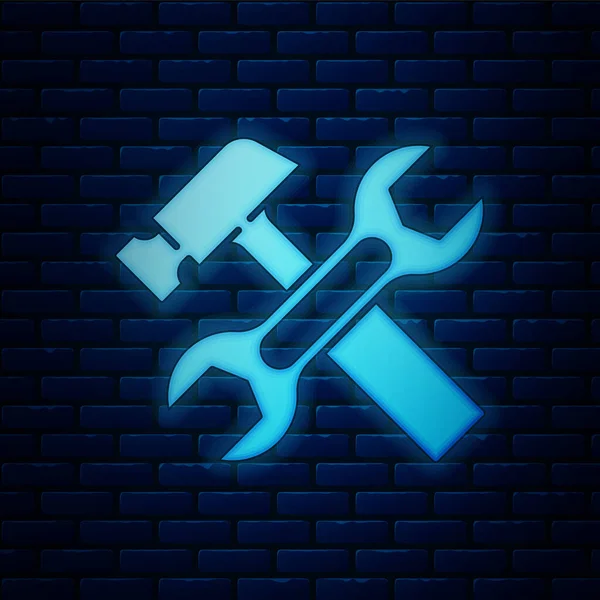 Glowing Neon Crossed Hammer Wrench Spanner Icon Isolated Brick Wall — Stock Vector