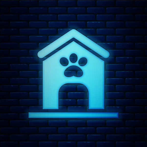 Glödande neon hund hus och tass utskrift husdjur ikon isolerad på tegel vägg bakgrund. Hundkennel. Vektor — Stock vektor