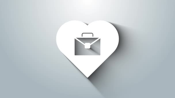 Белое сердце с иконкой текстовой работы на сером фоне. Видеографическая анимация 4K — стоковое видео