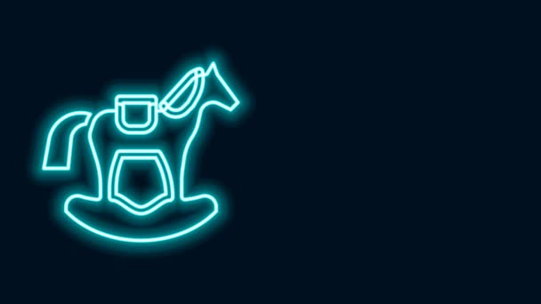 Zářící neonová linie Dřevěný kůň v sedle houpačka pro malé děti ikona izolované na černém pozadí. Grafická animace pohybu videa 4K — Stock video
