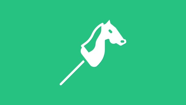 白いおもちゃの馬のアイコンは緑の背景に隔離された。4Kビデオモーショングラフィックアニメーション — ストック動画