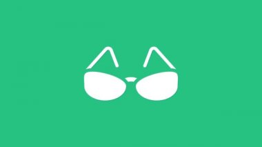 Yeşil arkaplanda beyaz gözlük simgesi izole edildi. Gözlük çerçevesi sembolü. 4K Video hareketli grafik canlandırması