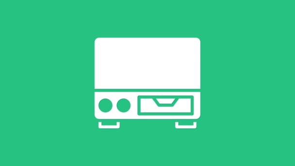 White Old video cassette player icon isolated on green background. Old beautiful retro hipster video cassette recorder. 4K Video motion graphic animation — Vídeo de Stock