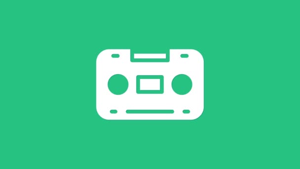 White Retro audio cassette tape icon isolated on green background. 4K Video motion graphic animation — Stock Video