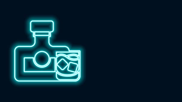 Glowing neon line Whiskey bottle and glass icon isolated on black background. 4K Video motion graphic animation — Stock Video