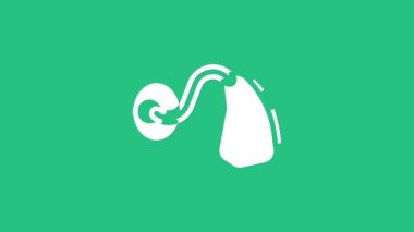 Yeşil arkaplanda beyaz işitme cihazı simgesi izole edildi. Kulak ve işitme. 4K Video hareketli grafik canlandırması