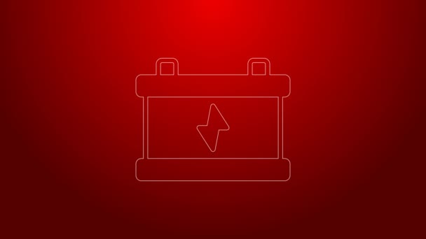 Grüne Linie Autobatterie-Symbol isoliert auf rotem Hintergrund. Akkubatterie Energie und Akkubatterie Strom. 4K Video Motion Grafik Animation — Stockvideo