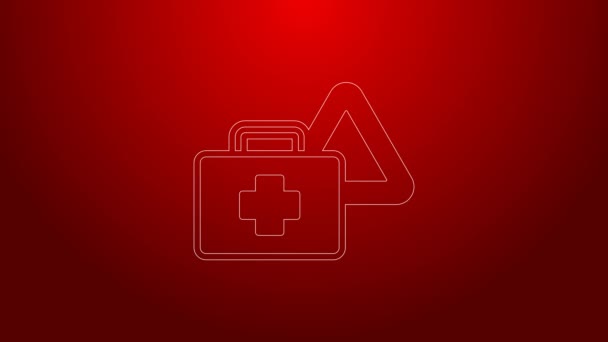 Green line First aid kit and warning triangle icon isolated on red background. Must be in the car. 4K Video motion graphic animation — Stock Video
