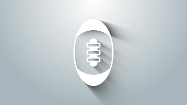 Vit amerikansk fotboll ikon isolerad på grå bakgrund. Rugbybollsikonen. Lagets sportspel symbol. 4K Video motion grafisk animation — Stockvideo