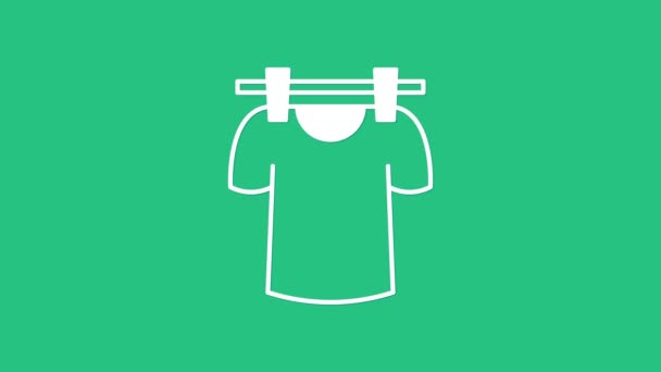 White Drying clothes icon isolated on green background. Clean shirt. Wash clothes on a rope with clothespins. Clothing care and tidiness. 4K Video motion graphic animation — Stock Video