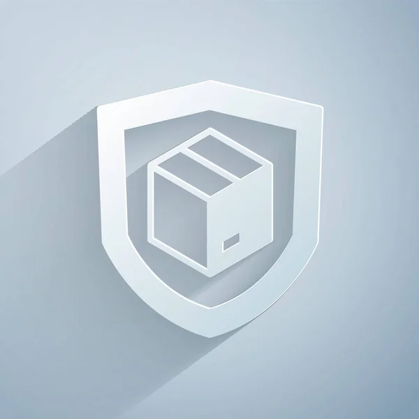 Kağıt kesiği. Gri arkaplanda kalkan simgesi olan teslimat güvenliği. Teslimat sigortası. Kalkanın ötesinde sigorta kutuları var. Kağıt sanatı tarzı. Vektör
