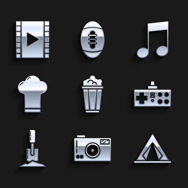 Set Popcorn in cardboard box, Photo camera, Tourist tent, Gamepad, Shovel the ground, Chef hat, Music note, tone and Play Video icon. Vector — Stock Vector