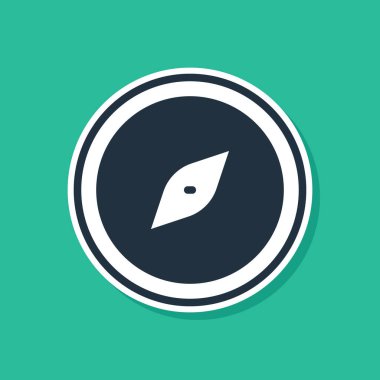 Mavi Pusula simgesi yeşil arkaplanda izole edildi. Rüzgâr yön bulma sembolü. Rüzgar gül işareti. Vektör.