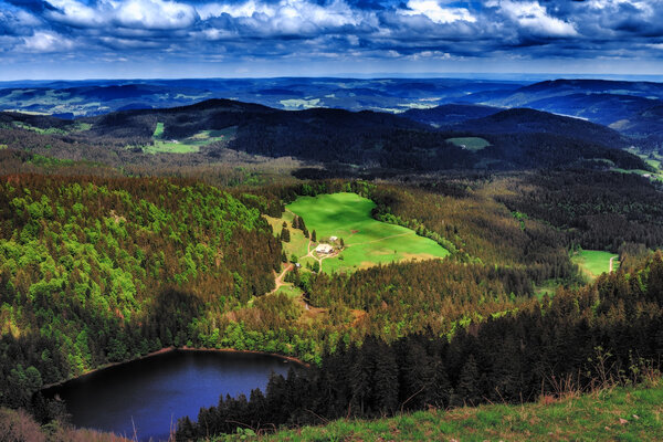 Feldberg Mountain in Germany in Spring. Lovely Hills and Forests. Blue cloudy sky. Fantastic Landscape