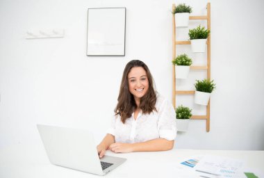 young business entrepreneur businesswoman working in her office clipart