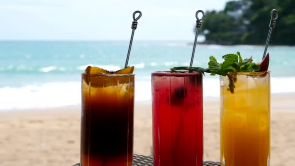 Bright Healthy Berries Cocktails on Table on Beach with Blue Sea on Background — Stock Video