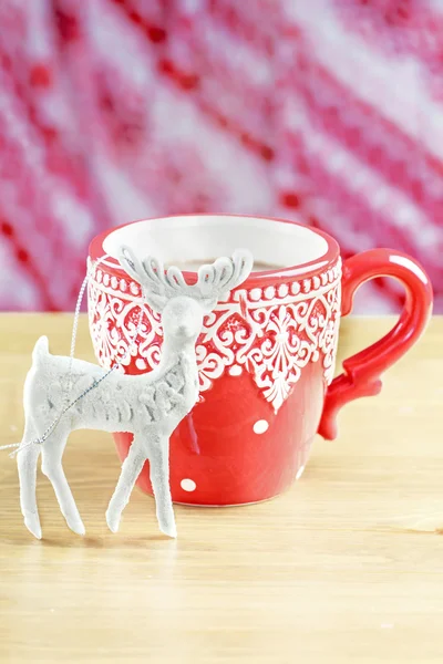 Cup of hot cocao with christmas deer toy — Stock Photo, Image