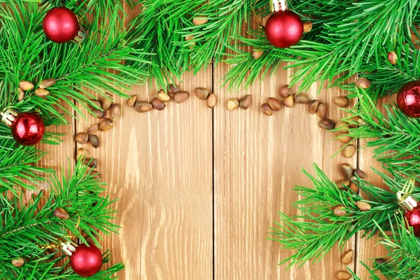 Fir branches with pine nuts and christmas toys. Copyspace background. — Stock Photo, Image