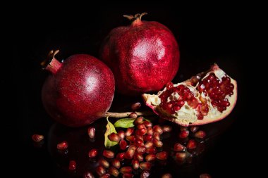 ripe pomegranates on a dark background. selective focus.
