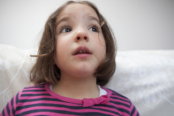 Distracted three years old  little girl