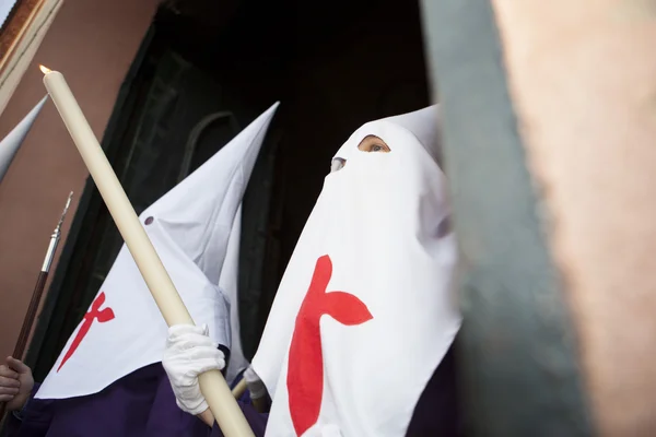 Nazareno holding large candle at Holy Week, Spain — Stock Photo, Image