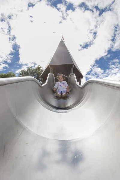 Baby adventurer on huge slide — Stock Photo, Image