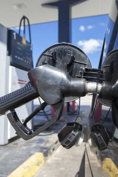 Car refueling on a petrol station. Nozzle detail — Stock Photo, Image