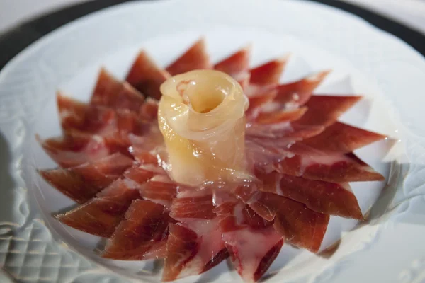 Decorative arrangement of iberian cured ham — Stock Photo, Image