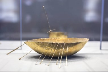Dublin, Ireland - Feb 20th, 2020: Gold sailing ship. Artefacts that belongs to Iron Age Broighter hoard set. Archaeology National Museum of Ireland clipart