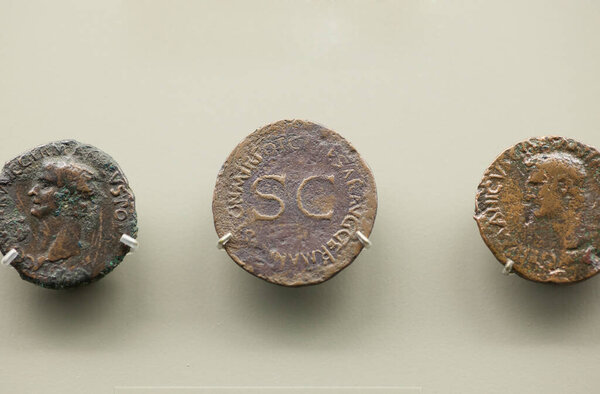 Merida, Spain - Nov 14th, 2020: Germanicus roman prominent general coins. National Museum of Roman Art in Merida, Spain