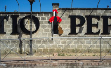 Jerez de la Frontera, Spain - June 1st, 2019: Large Tio Pepe bottle logo attached to Gonzales Byass Bodega, Jerez de la Frontera, Spain