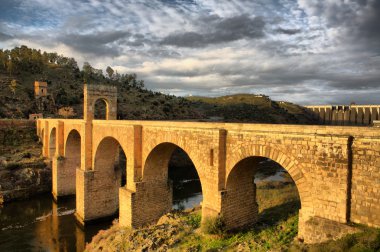 Roman bridge of Alcantara, sunny side clipart