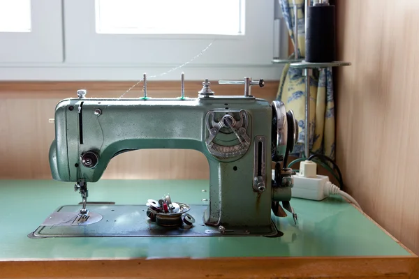 Green electrical sewing machine — Stock Photo, Image