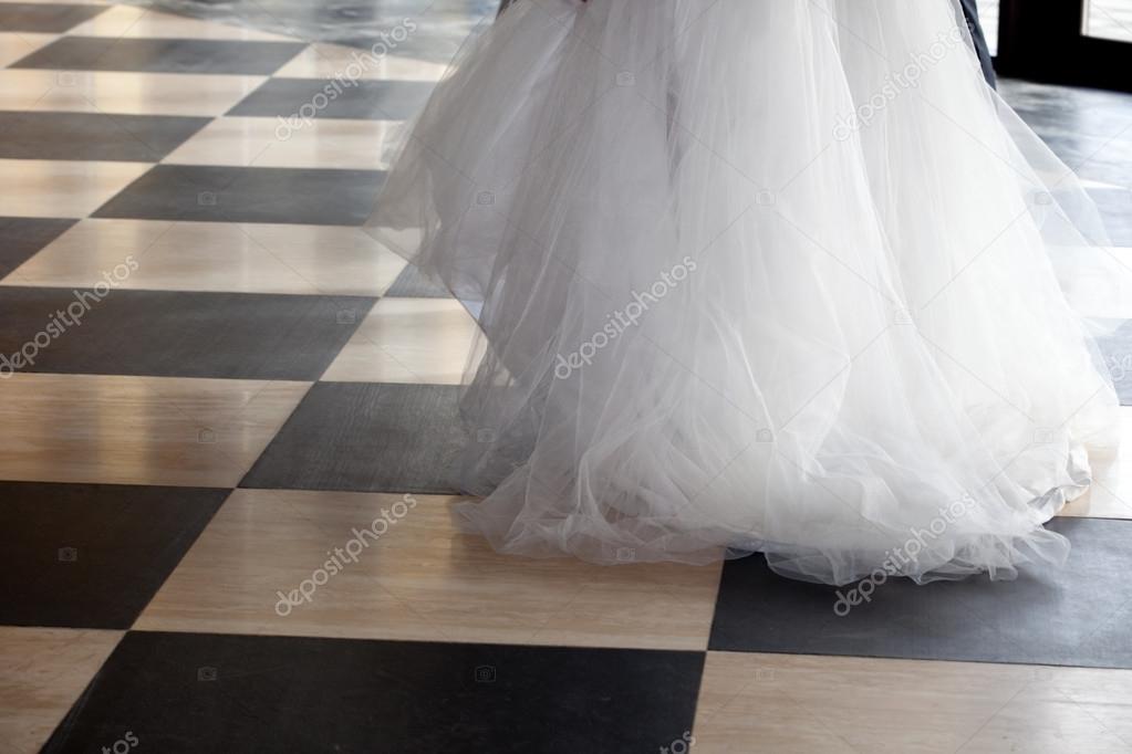 Bride over chequered floor