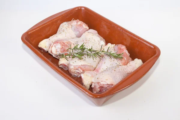 Raw chicken little legs with rosemary — Stock Photo, Image