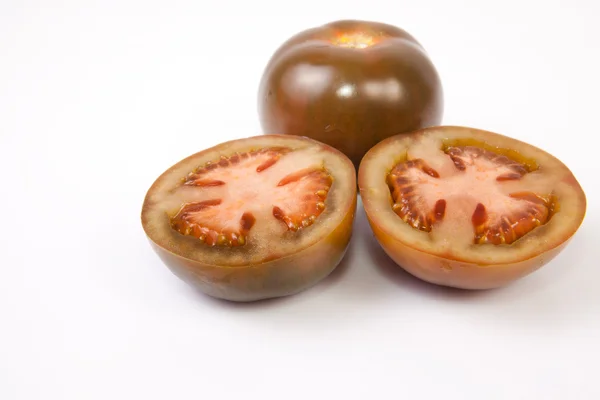 Ganze und in Scheiben geschnittene Tomaten — Stockfoto