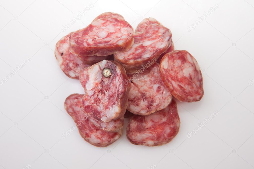 Cut pieces of cured spicy sausage