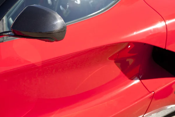 Red sports car wing mirror — Stock Photo, Image