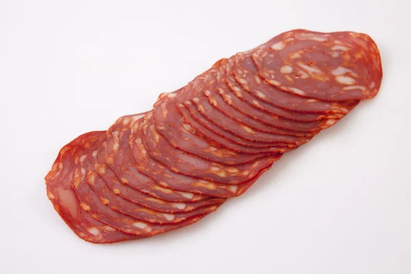 Cut slices of red iberian chorizo — Stock Photo, Image