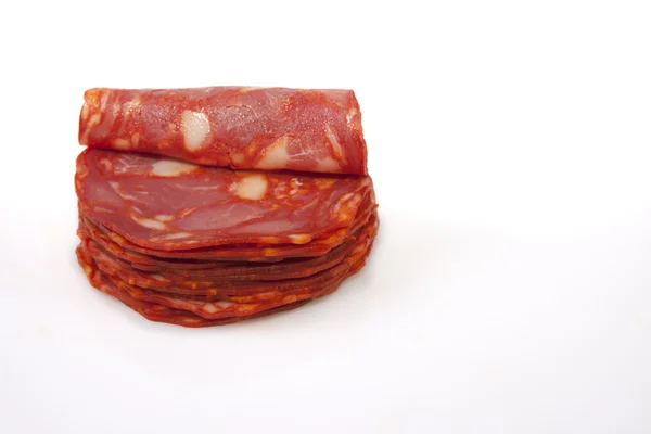 Corte fatias de chouriço ibérico vermelho — Fotografia de Stock