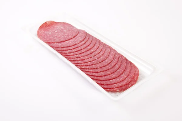 Sliced salami on the package — Stock Photo, Image